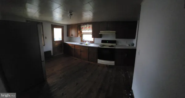 a kitchen with stainless steel appliances a sink stove and refrigerator