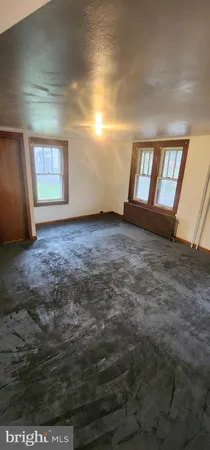 a view of an empty room and window