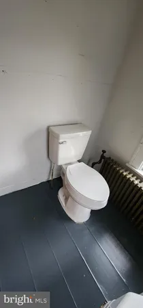 a bathroom with a toilet and a sink