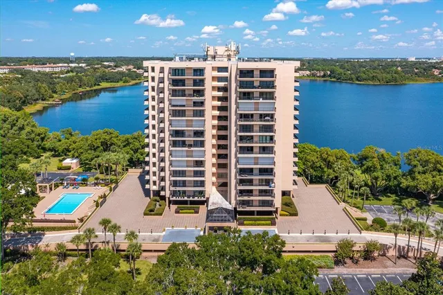 a view of building with outdoor space and lake view