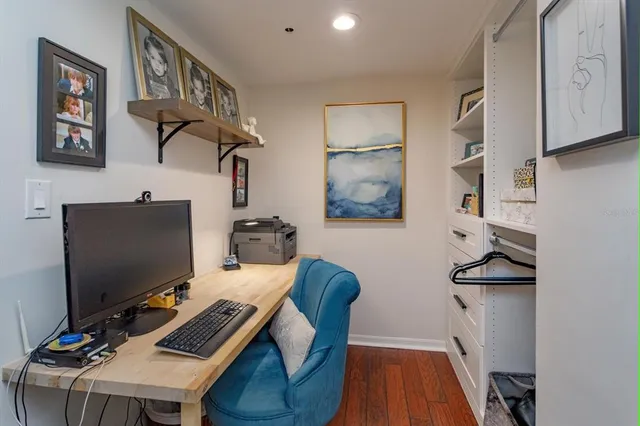 a bedroom with furniture and a flat screen tv