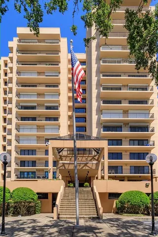 a front view of a building with outdoor space