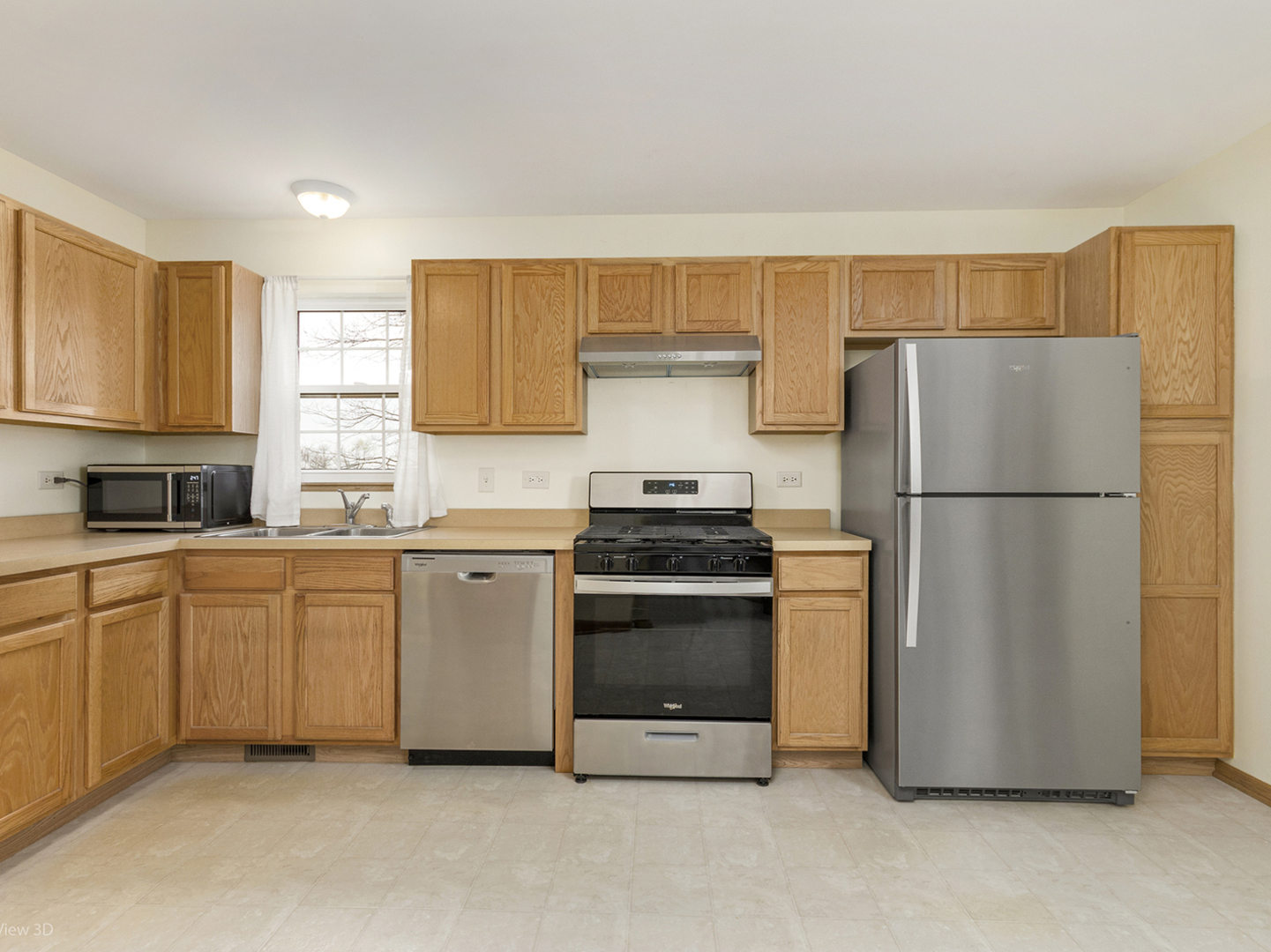 4709 West Iris Lane Monee, IL 60449 - Photo 12 of 28 a kitchen with stainless steel appliances granite countertop a refrigerator a sink a stove a microwave and cabinets