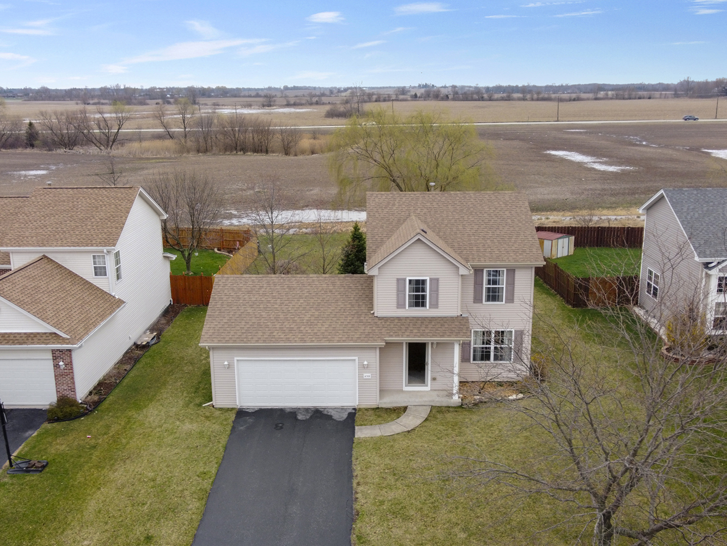 4709 West Iris Lane Monee, IL 60449 - Photo 2 of 28 an aerial view of a house with a lake view