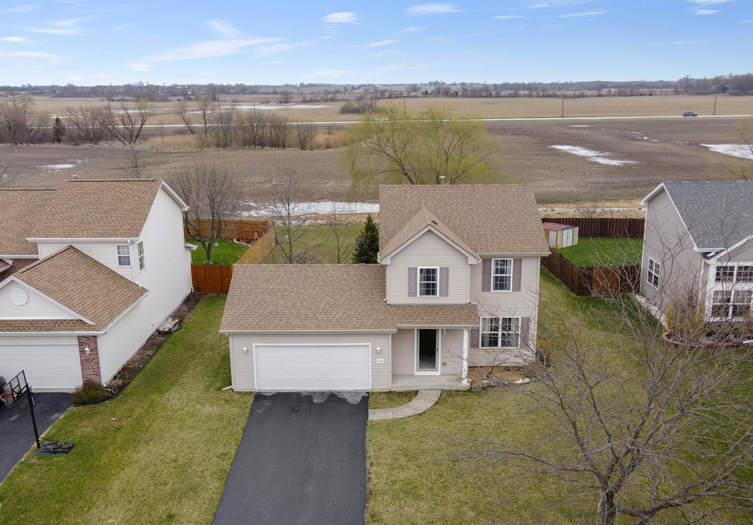 4709 West Iris Lane Monee, IL 60449 - Photo 28 of 28 an aerial view of a house with a lake view