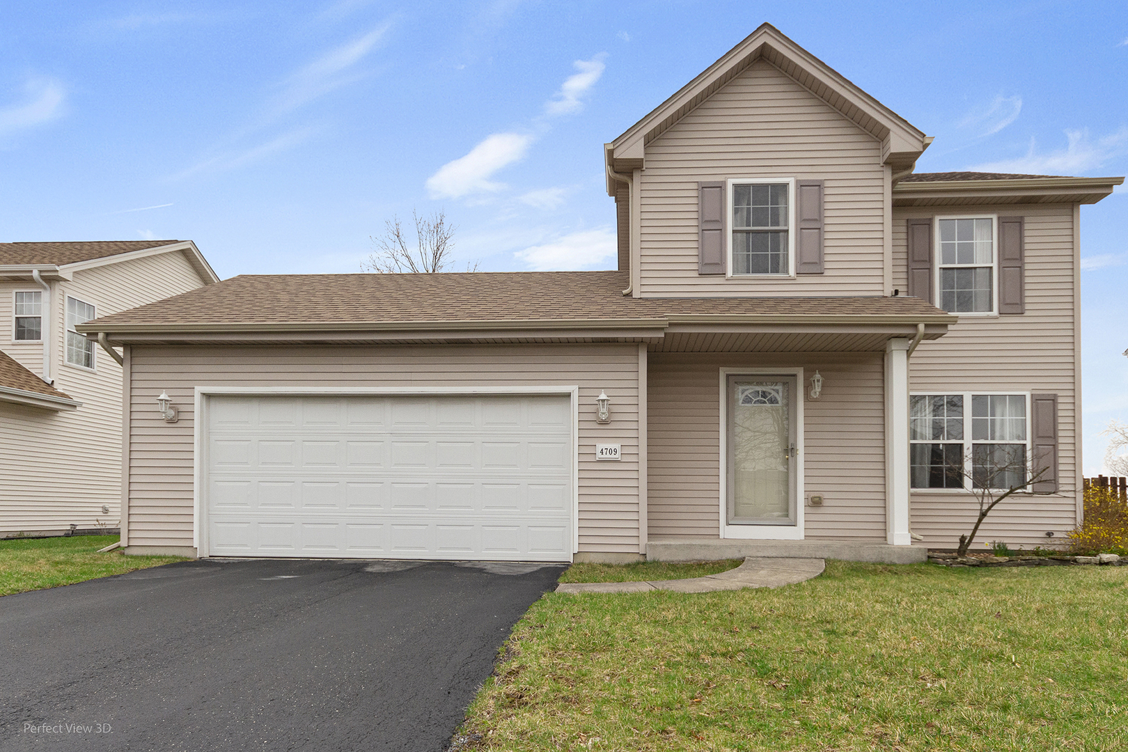 4709 West Iris Lane Monee, IL 60449 - Photo 4 of 28 a front view of a house with a yard and garage