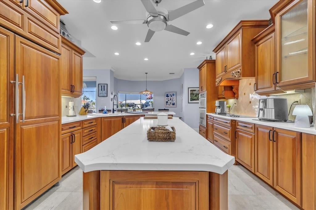2172 Deborah Drive Punta Gorda, FL 33950 - Photo 13 of 61 a kitchen with stainless steel appliances granite countertop a sink a refrigerator and a stove top oven