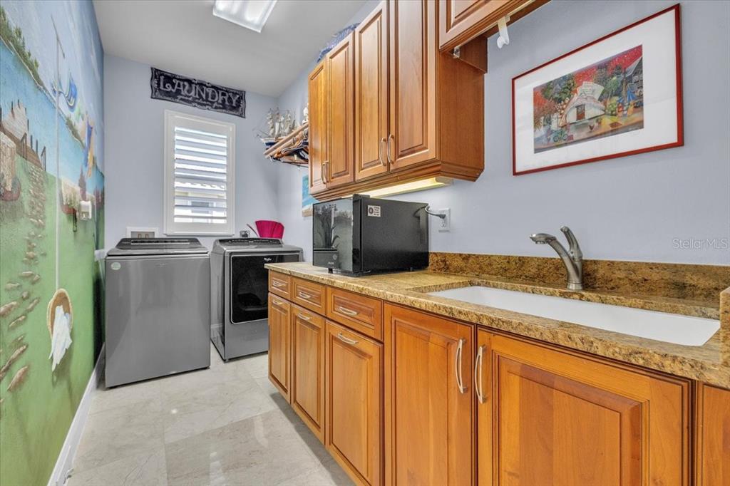 2172 Deborah Drive Punta Gorda, FL 33950 - Photo 23 of 61 a kitchen with stainless steel appliances granite countertop a sink dishwasher stove and refrigerator