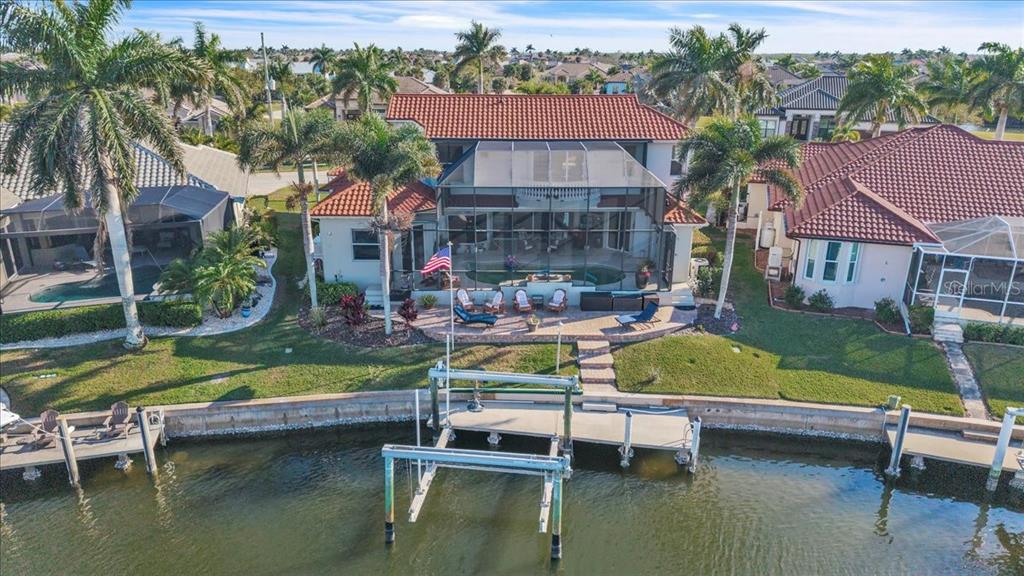 2172 Deborah Drive Punta Gorda, FL 33950 - Photo 3 of 61 a view of swimming pool with outdoor seating and lake view