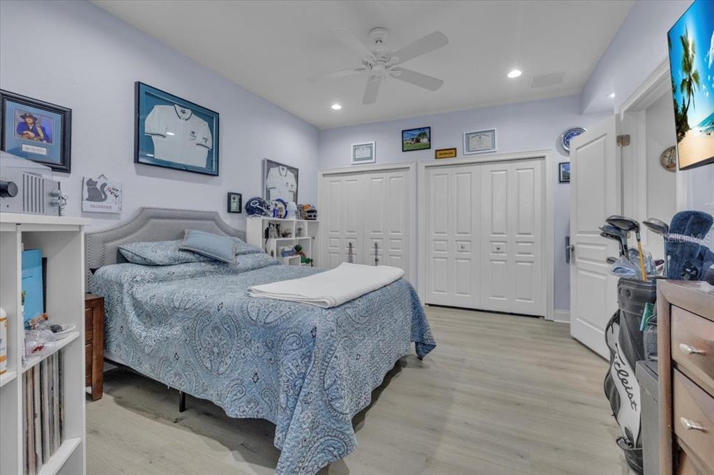 2172 Deborah Drive Punta Gorda, FL 33950 - Photo 39 of 61 a spacious bedroom with a bed a mirror and a desk