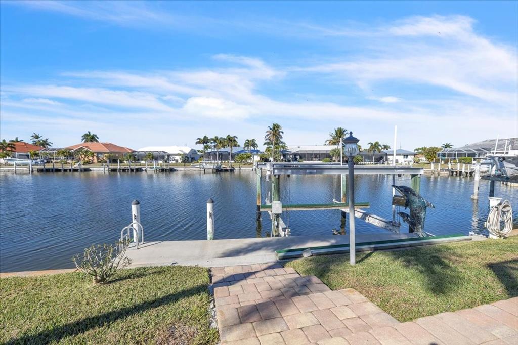 2172 Deborah Drive Punta Gorda, FL 33950 - Photo 46 of 61 a view of a lake with a yard and outdoor seating