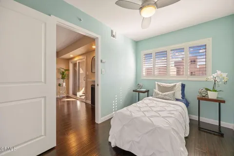 a bedroom with a bed and a table