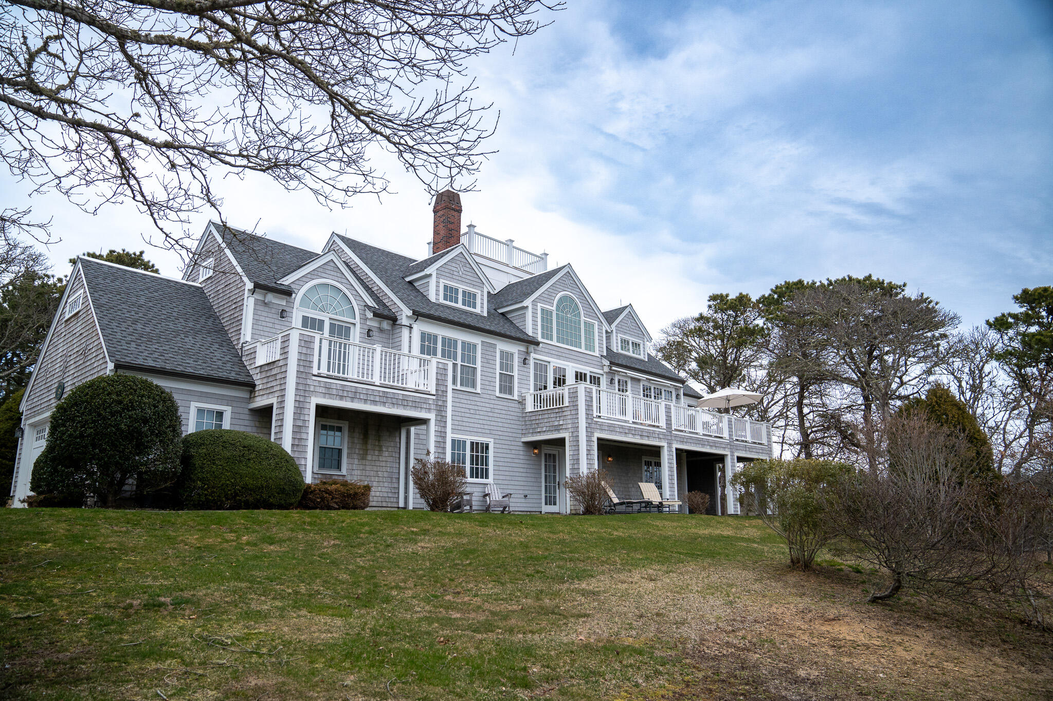 48 South Chatham Road Harwich, MA 02645 - Photo 1 of 54 a front view of a house with a garden