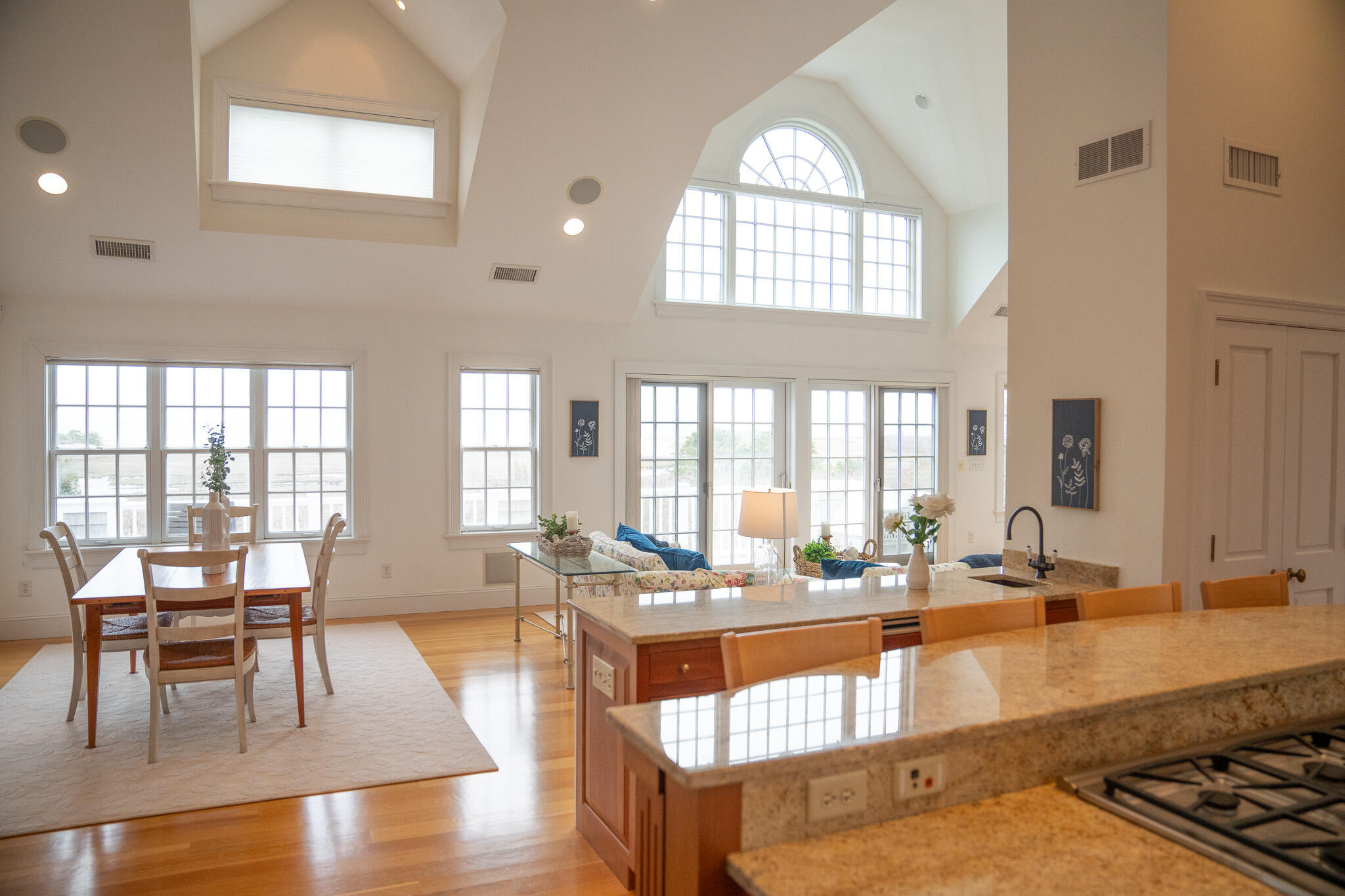 48 South Chatham Road Harwich, MA 02645 - Photo 13 of 54 a dining room with wooden floor and large windows