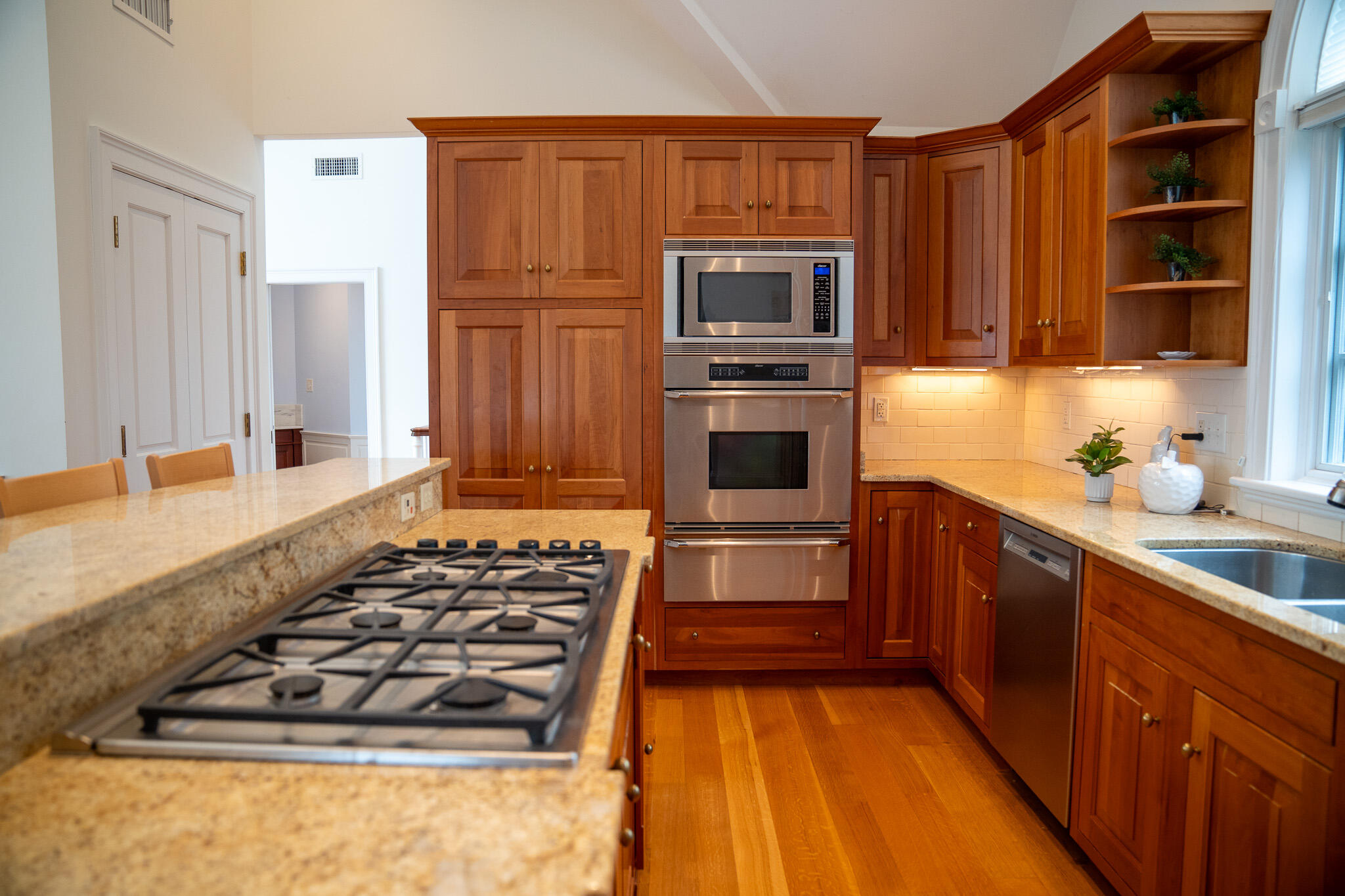 48 South Chatham Road Harwich, MA 02645 - Photo 25 of 54 a kitchen with wooden cabinets and a stove top oven
