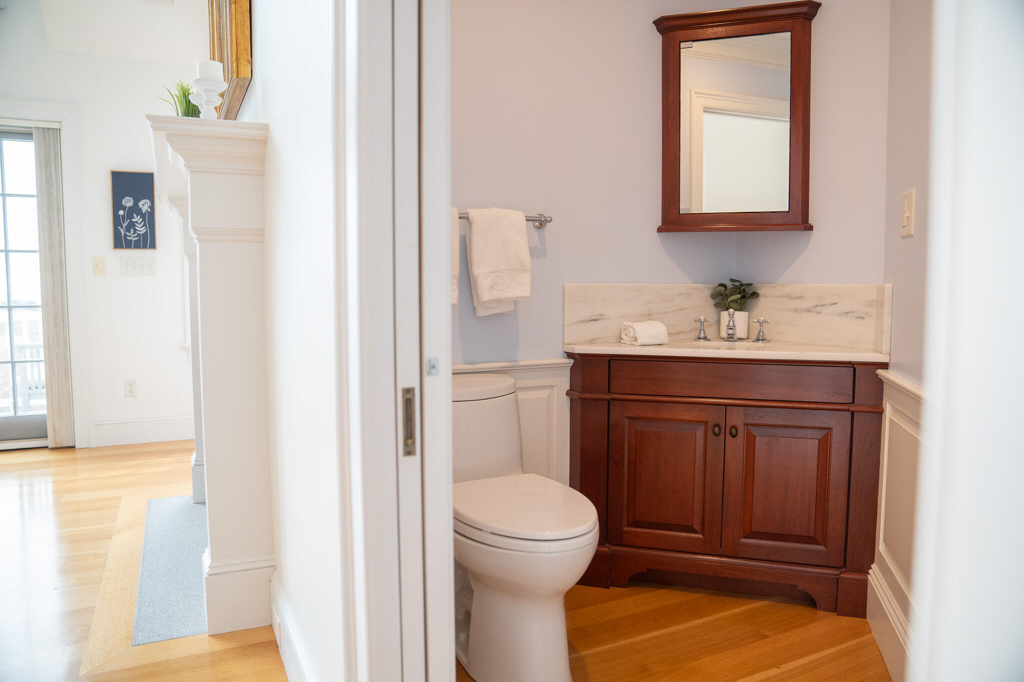 48 South Chatham Road Harwich, MA 02645 - Photo 26 of 54 a bathroom with a toilet a sink and a mirror