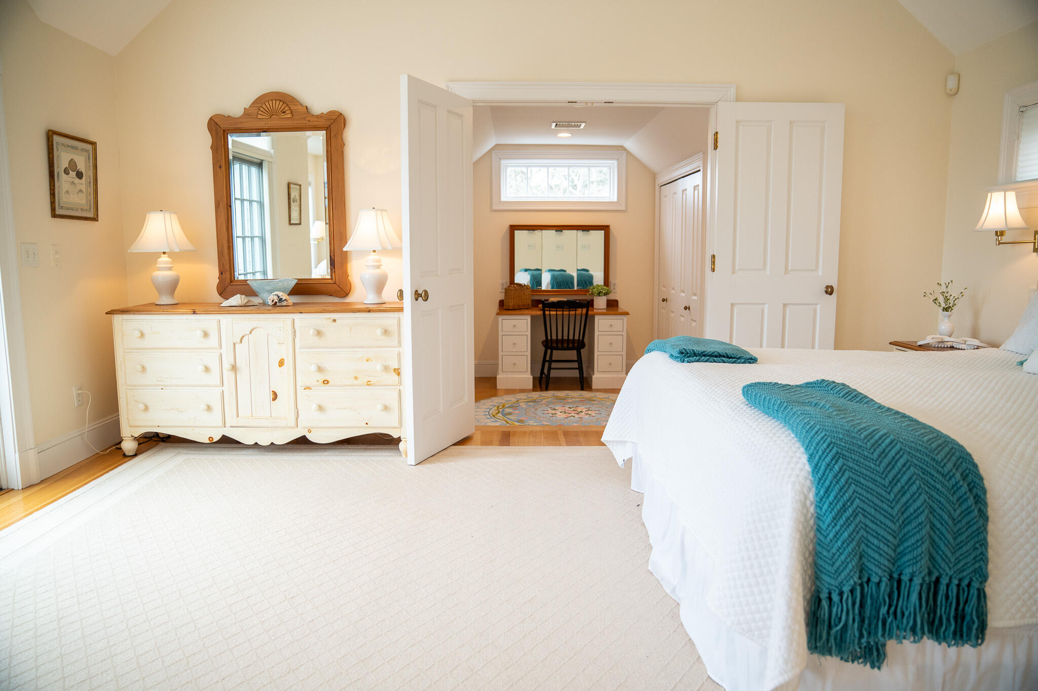 48 South Chatham Road Harwich, MA 02645 - Photo 29 of 54 a spacious bedroom with a bed and mirror