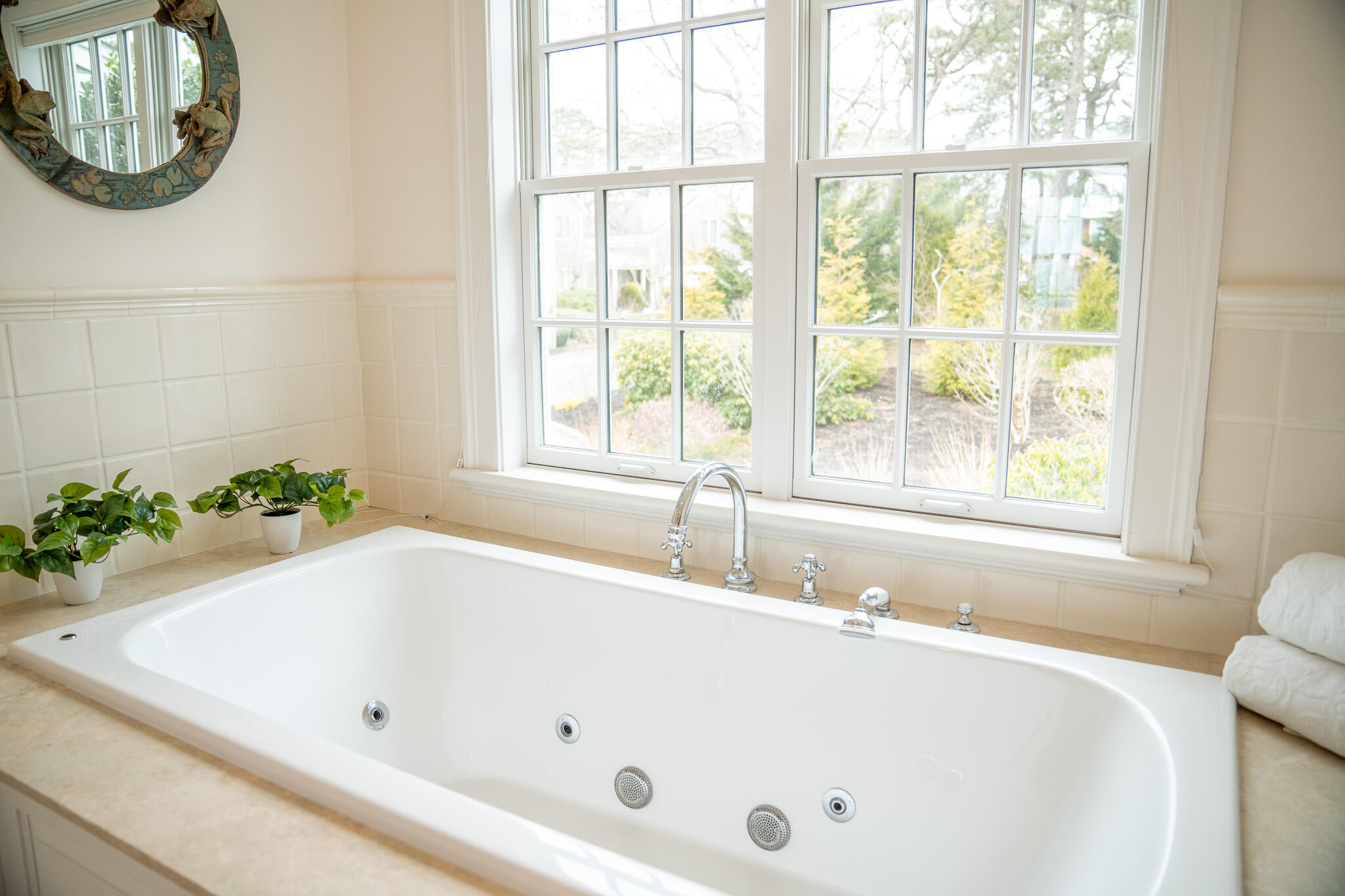 48 South Chatham Road Harwich, MA 02645 - Photo 36 of 54 a white bath tub sitting in a bathroom next to a window
