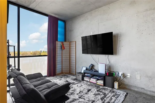a living room with furniture and a flat screen tv