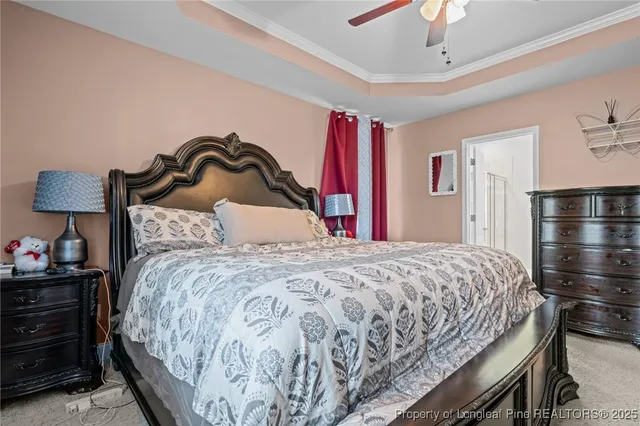 a bedroom with a bed and a flat tv screen