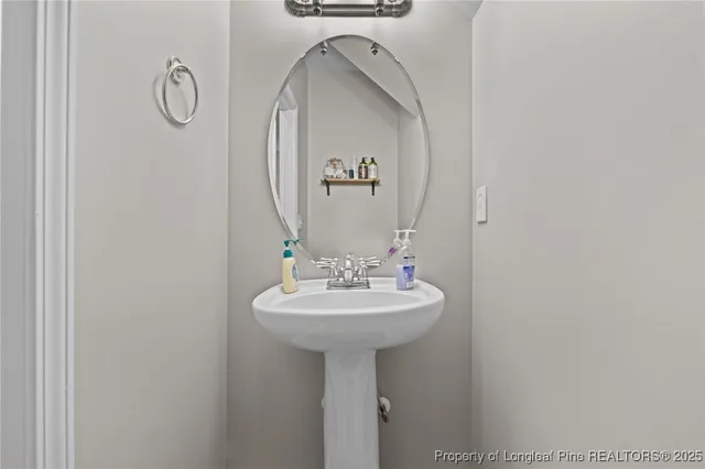 a view of a patio with iron fence