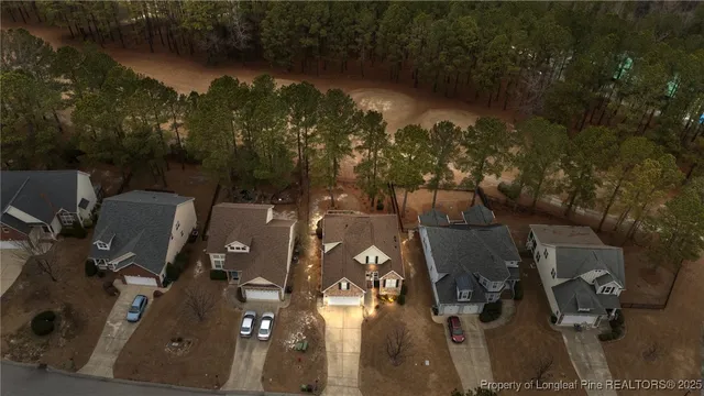 an aerial view of a house with outdoor space and lake view