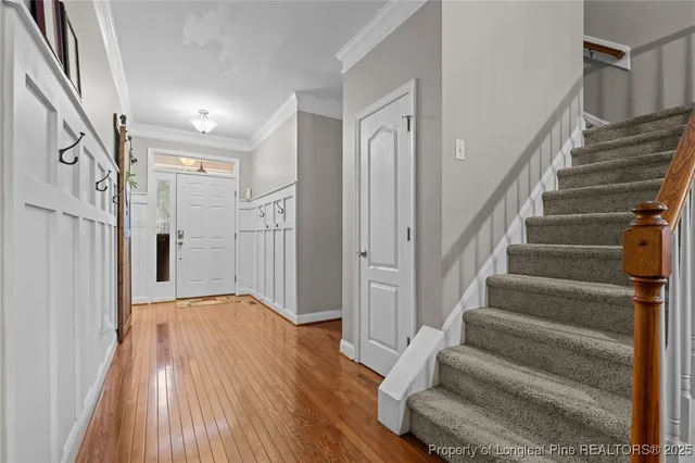 a bedroom with a bed window and dresser