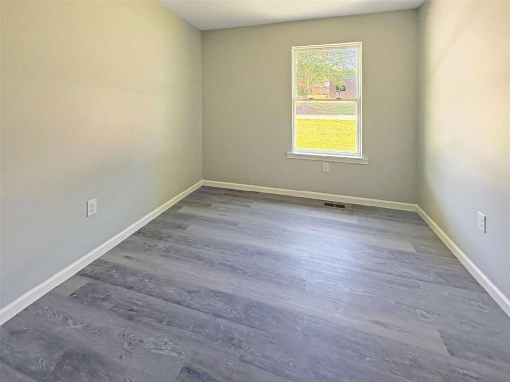 24 George Street Forsyth, GA 31029 - Photo 8 of 17 an empty room with a window
