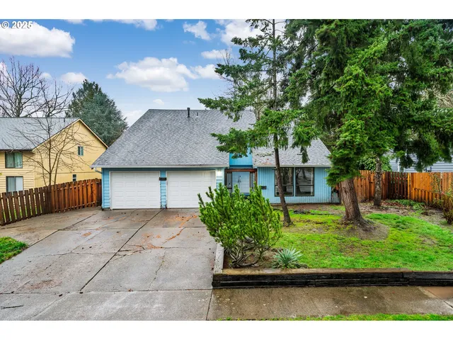 a view of backyard of house along with wooden floor