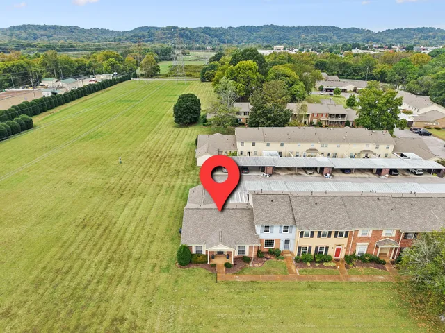 an aerial view of a house with a garden