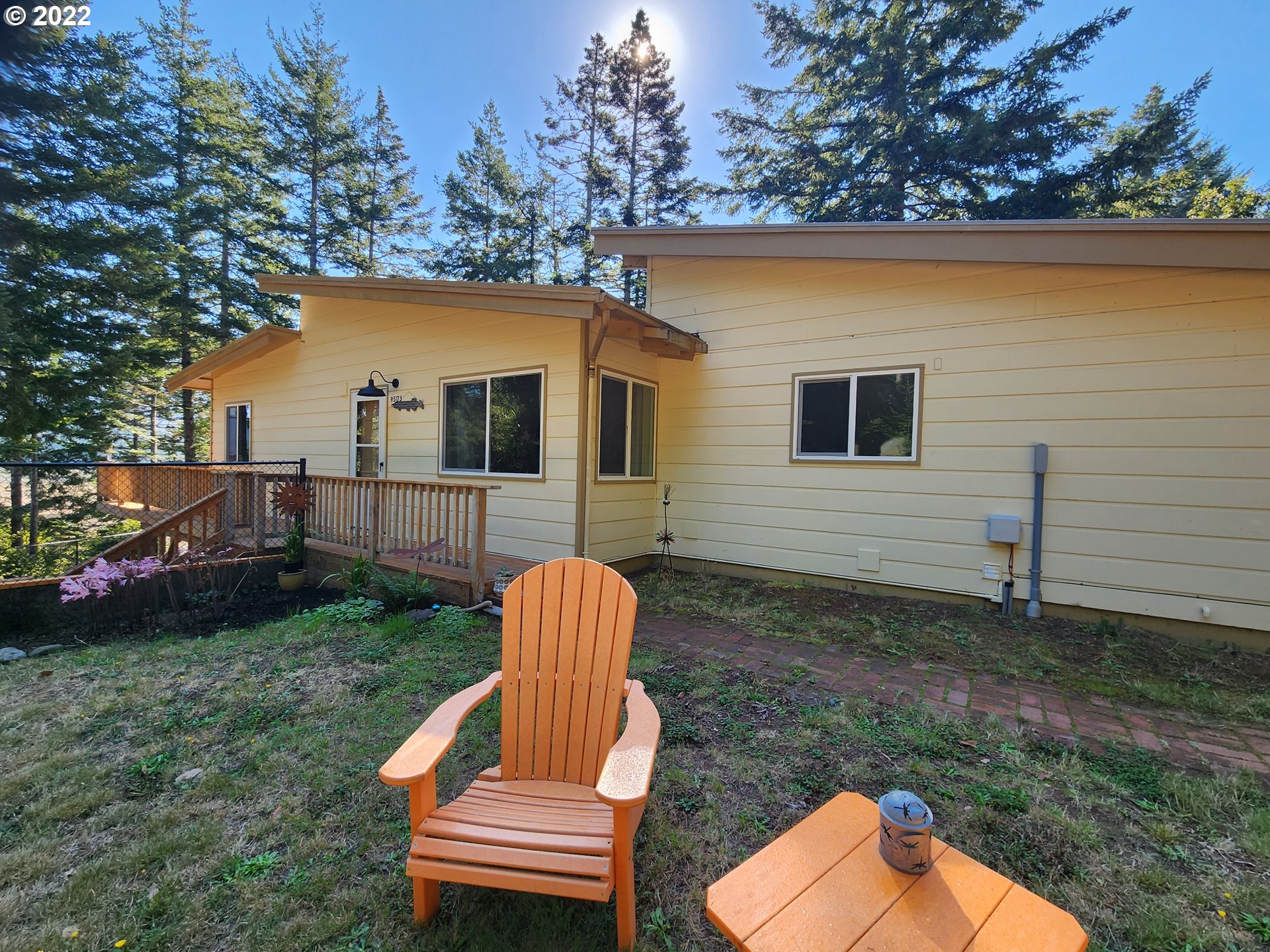 95175 Marchmont Road Gold Beach, OR 97444 - Photo 1 of 32 a house view with a garden space