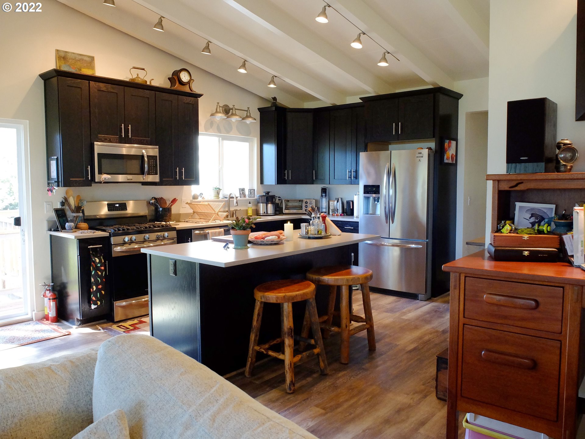 95175 Marchmont Road Gold Beach, OR 97444 - Photo 11 of 32 a kitchen with stainless steel appliances kitchen island granite countertop a refrigerator stove microwave and sink
