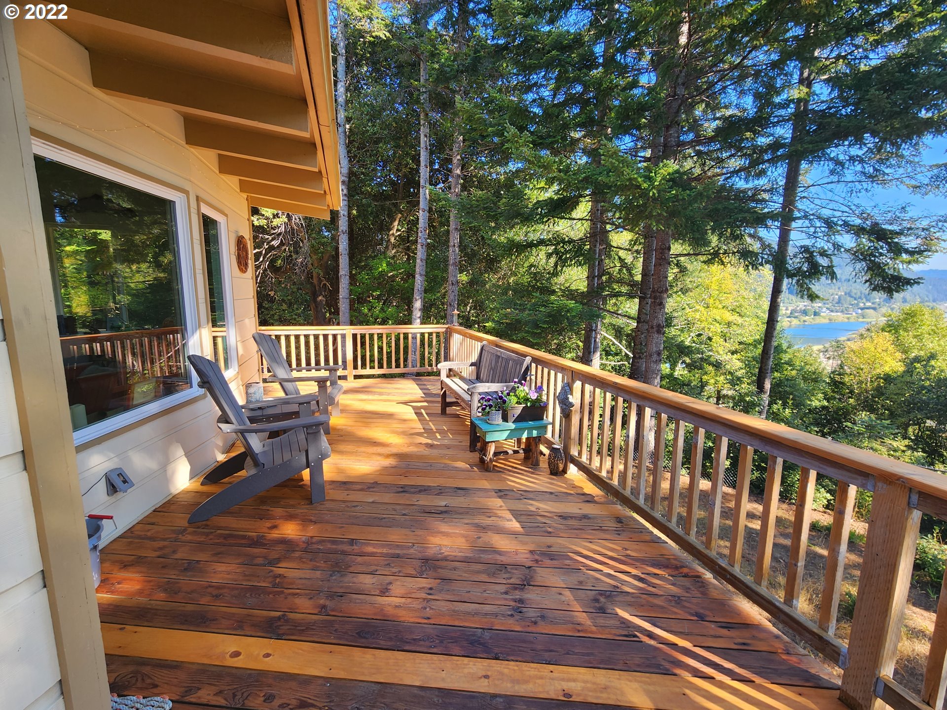 95175 Marchmont Road Gold Beach, OR 97444 - Photo 15 of 32 a view of balcony with wooden floor and outdoor seating
