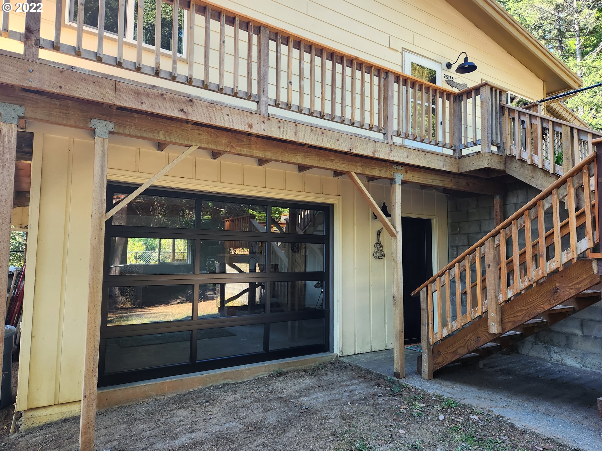 95175 Marchmont Road Gold Beach, OR 97444 - Photo 2 of 32 a view of staircase with a barbeque and wooden stairs