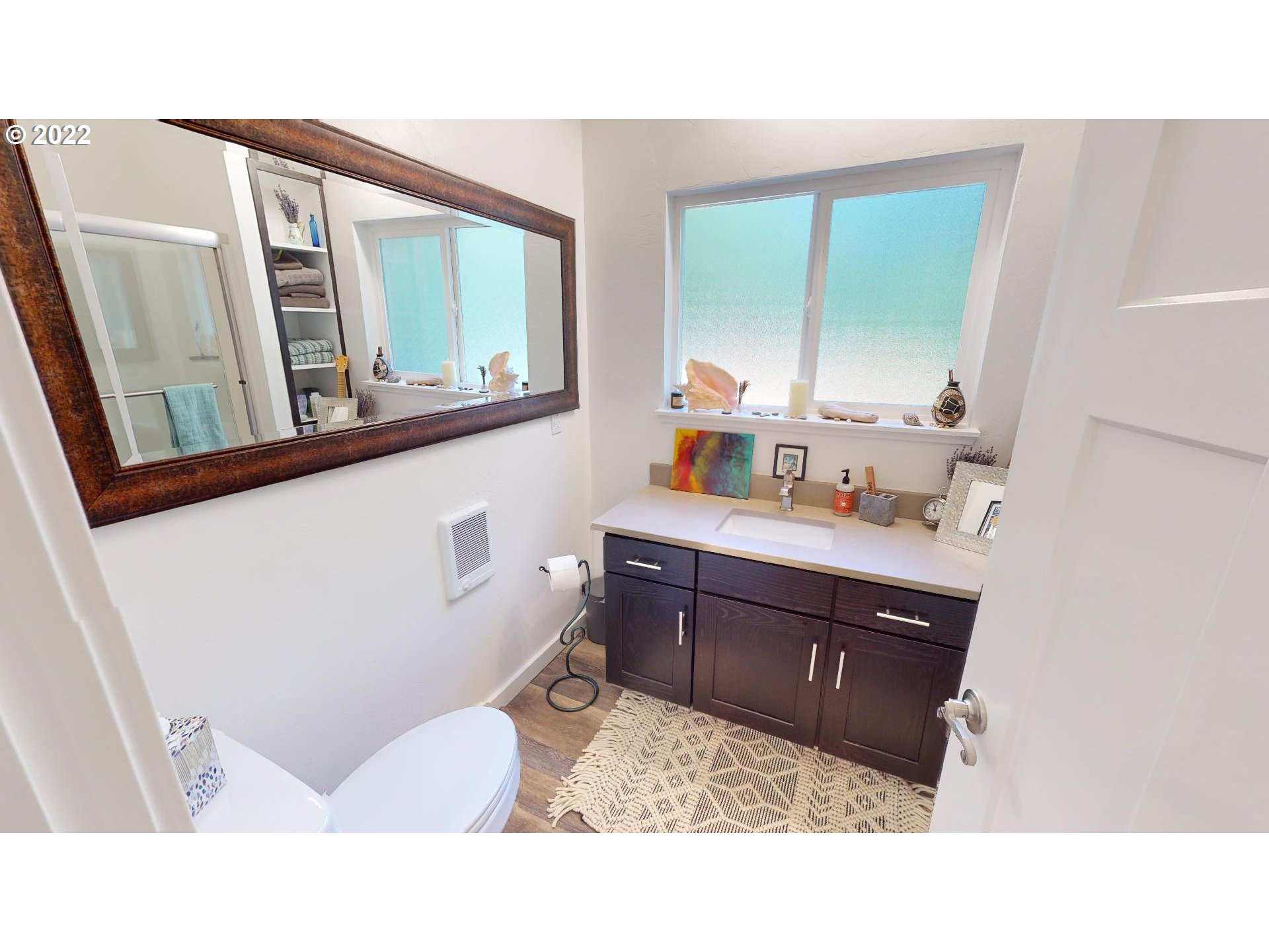 95175 Marchmont Road Gold Beach, OR 97444 - Photo 23 of 32 a bathroom with a sink a mirror and a toilet