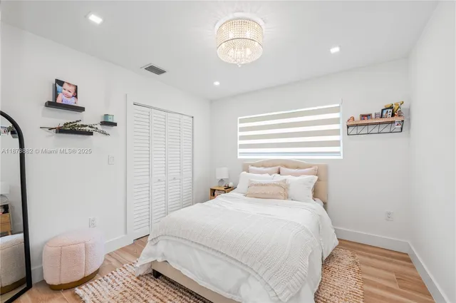 a bedroom with a bed and a chair