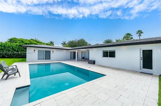 a view of house with swimming pool