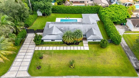a view of an outdoor space pool patio and outdoor seating