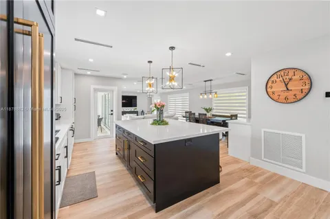 a kitchen with stainless steel appliances granite countertop a stove and a refrigerator
