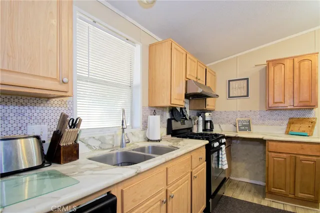 a kitchen with a refrigerator and a sink