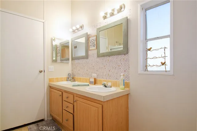 a bathroom with a shower and a sink