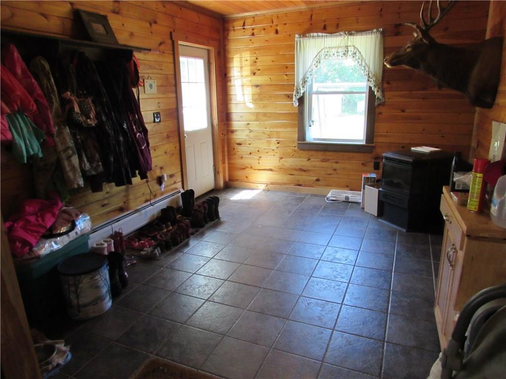 47 Small Road Plymouth, ME 04969 - Photo 5 of 12 Spacious mud room has a pellet stove...