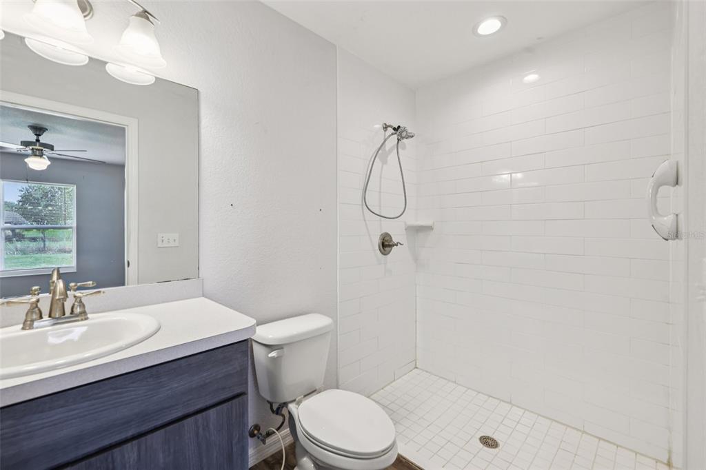 5 Laurel Pass Court Ocala, FL 34480 - Photo 13 of 23 a bathroom with a sink a toilet and shower