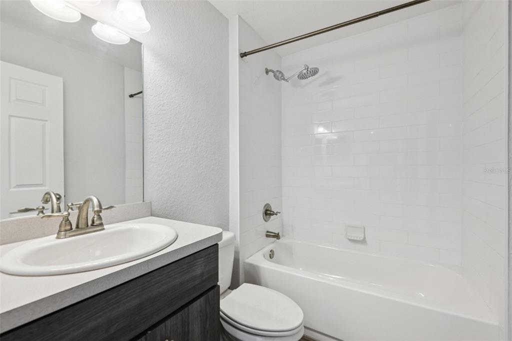 5 Laurel Pass Court Ocala, FL 34480 - Photo 17 of 23 a bathroom with a sink toilet vanity and shower