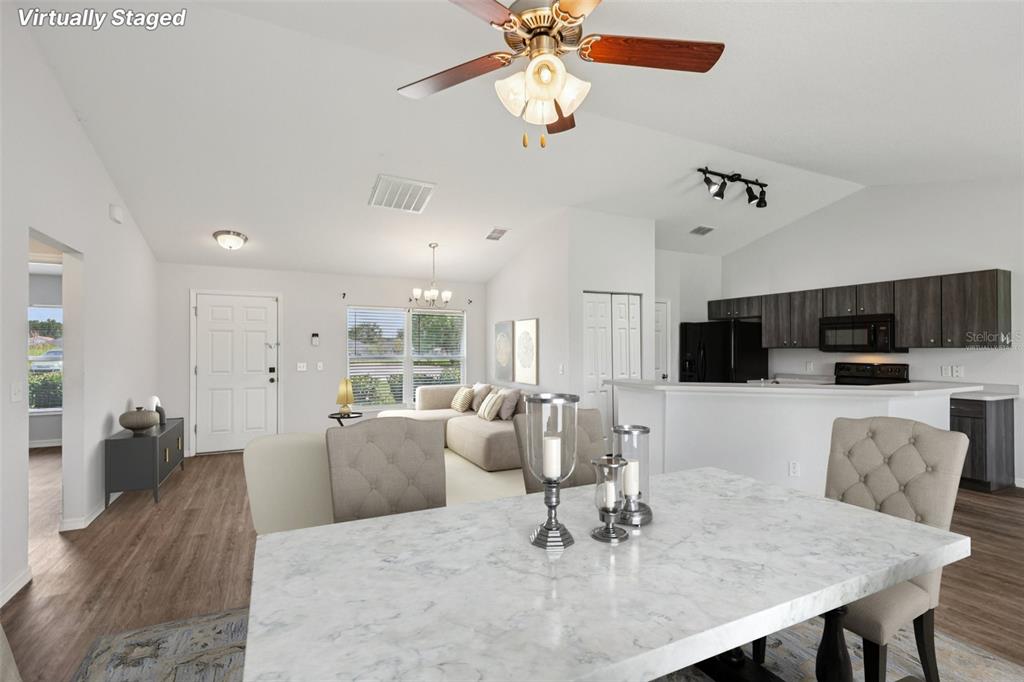 5 Laurel Pass Court Ocala, FL 34480 - Photo 4 of 23 a living room with furniture and a kitchen view