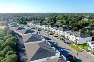 an aerial view of a city with lots of residential buildings