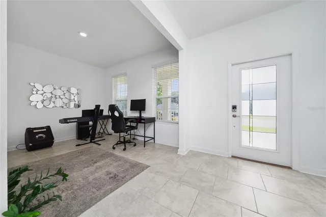 a kitchen with granite countertop a stove top oven and cabinets