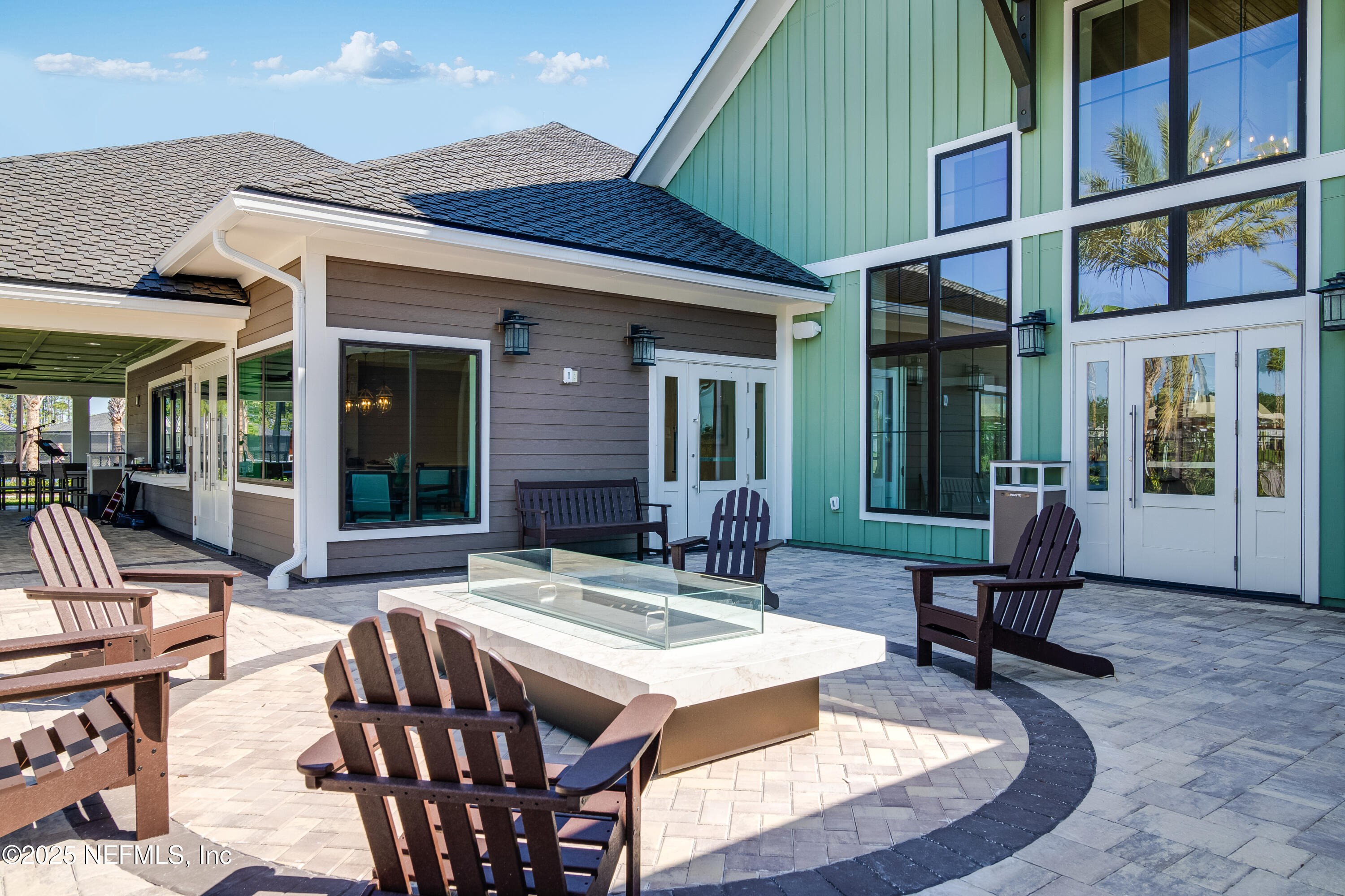 3199 Tupelo Loop Green Cove Springs, FL 32043 - Photo 12 of 26 a view of a patio with couches table and chairs and potted plants