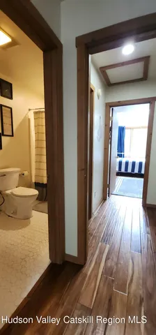 a view of a living room with a wooden floor
