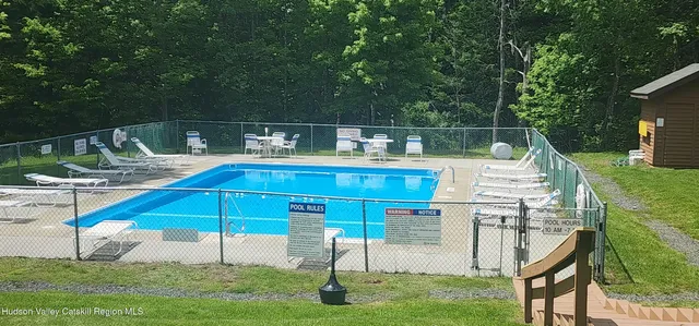 a house view with a sitting space and garden space